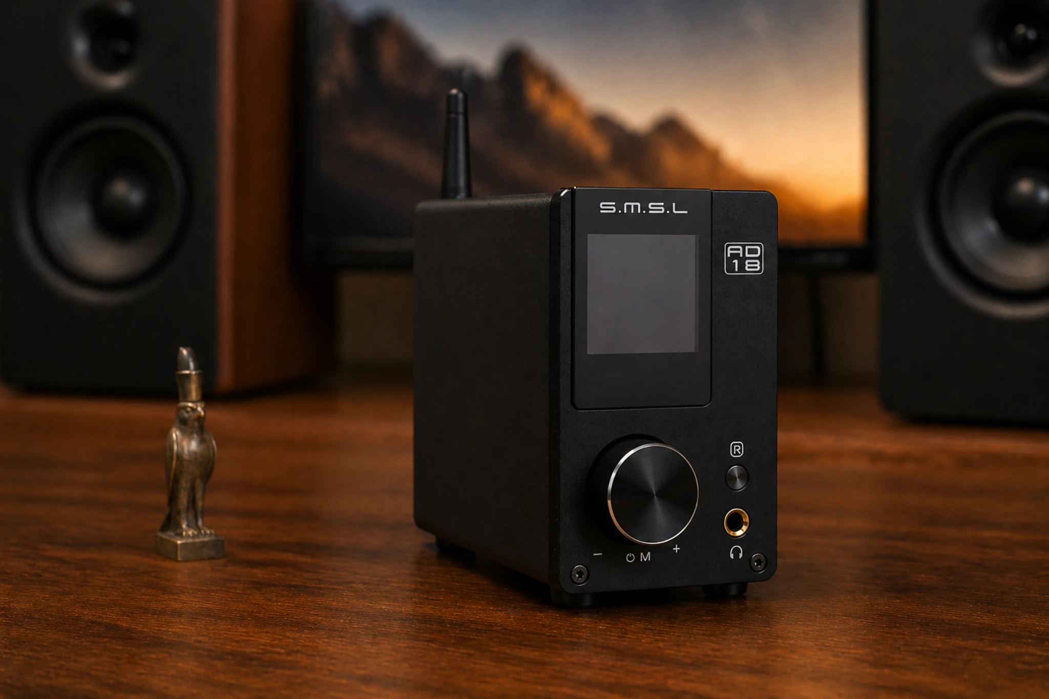 SMSL AD18 DAC amplifier connected to speakers and display in a modern setup