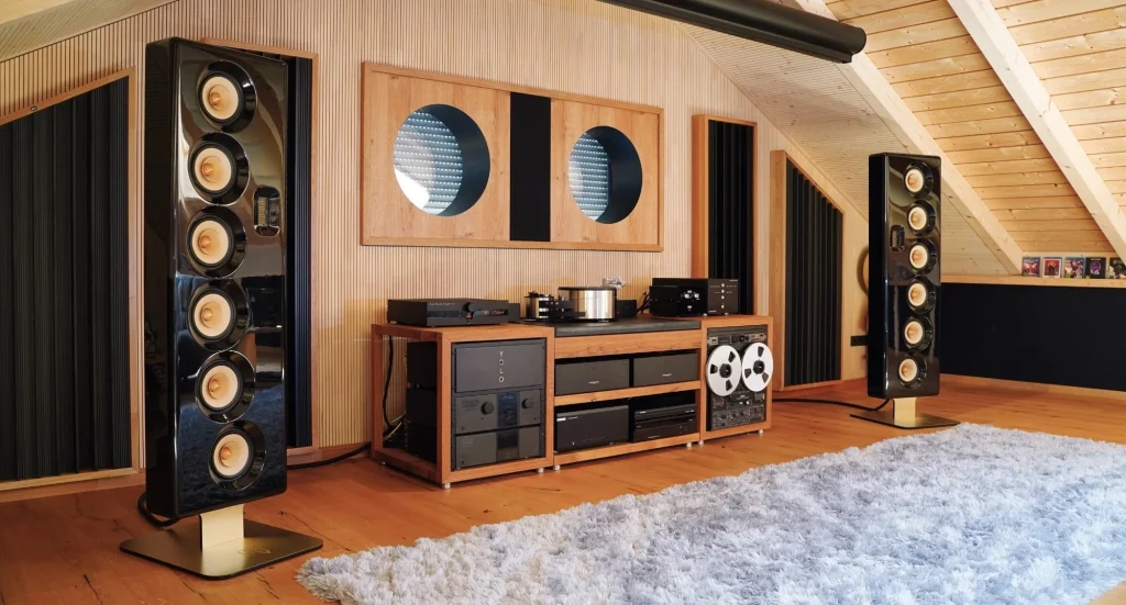 high-end home audio listening room with wireless-ready speakers and amplifier setup