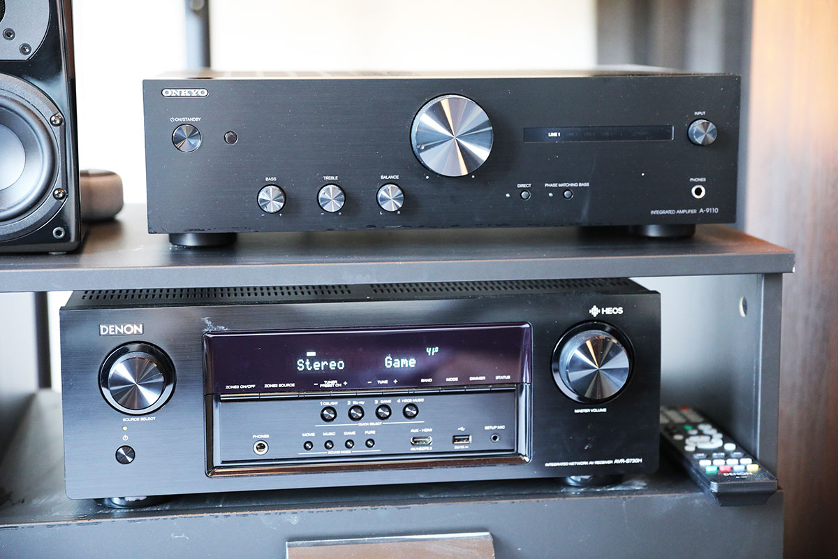 Budget audio amplifiers and AV receivers stacked together to compare size, design, and features