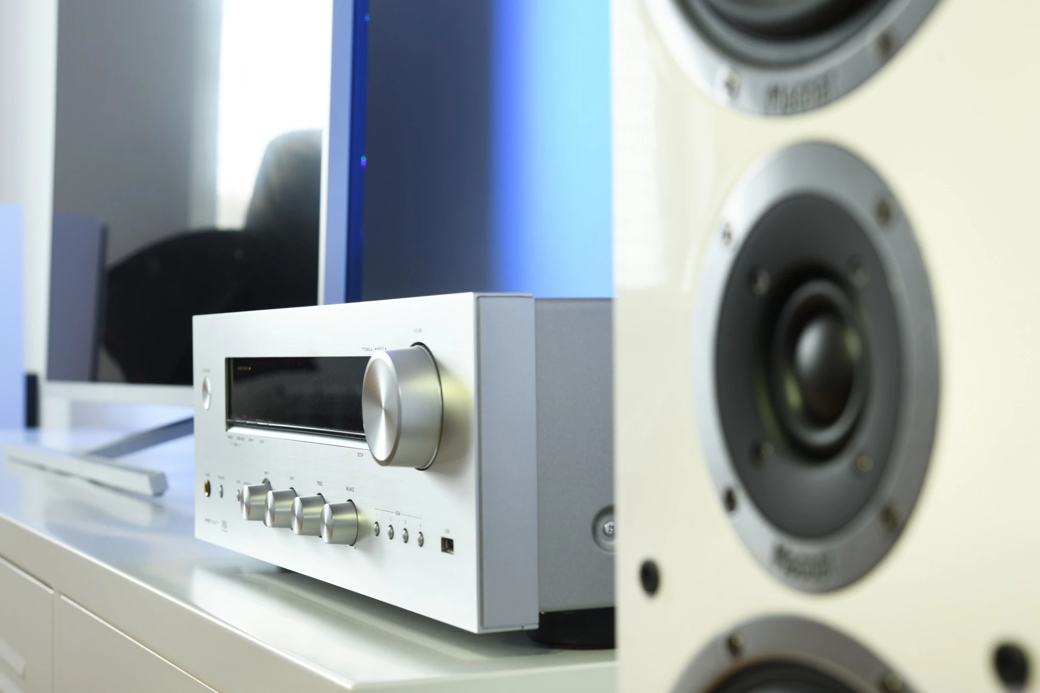 Compact stereo amplifier and bookshelf speaker in a small listening setup