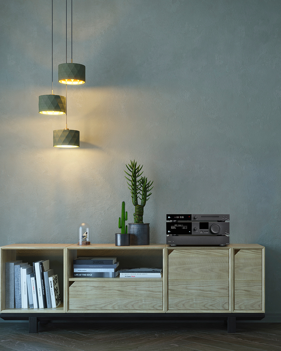 Minimal home audio setup showing amplifier integrated into a balanced speaker system in a modern living room
