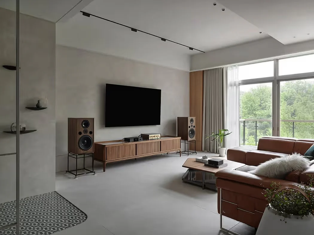 Well-balanced home audio system with stereo speakers integrated naturally into a modern living room, designed for both music and everyday use