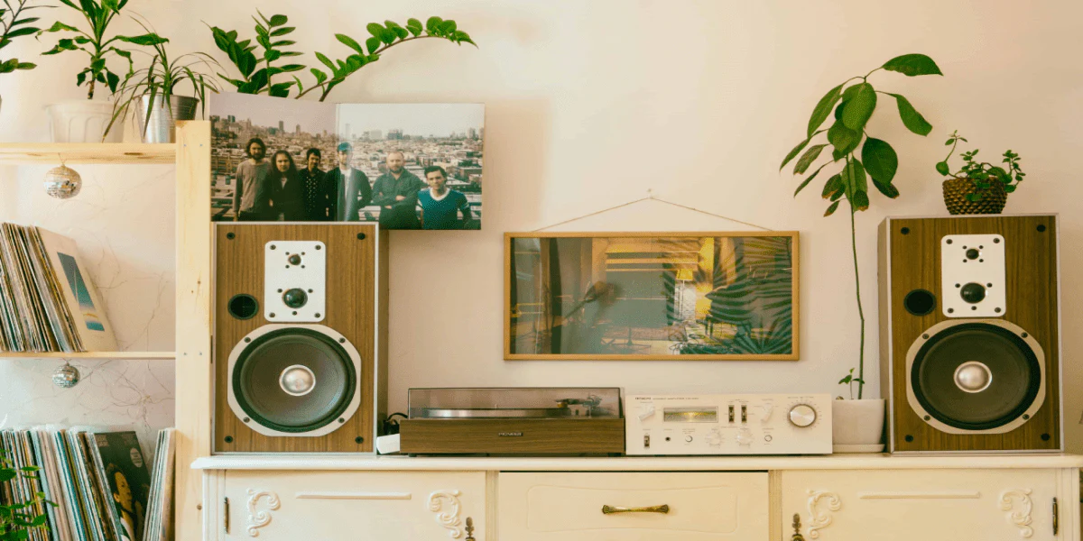 Simple home audio system with bookshelf speakers, amplifier, and turntable in a cozy living room setup