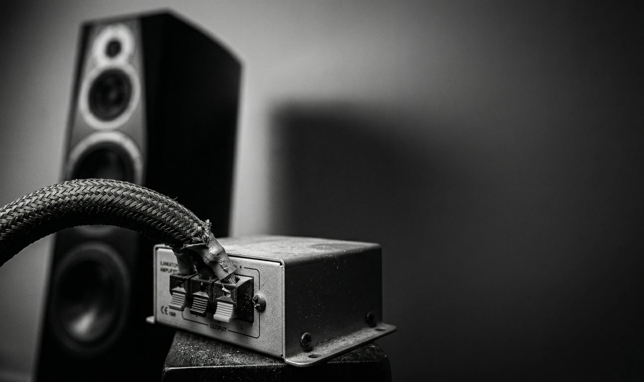 Thick speaker cable forced into a small weak amplifier causing a bottleneck in audio performance