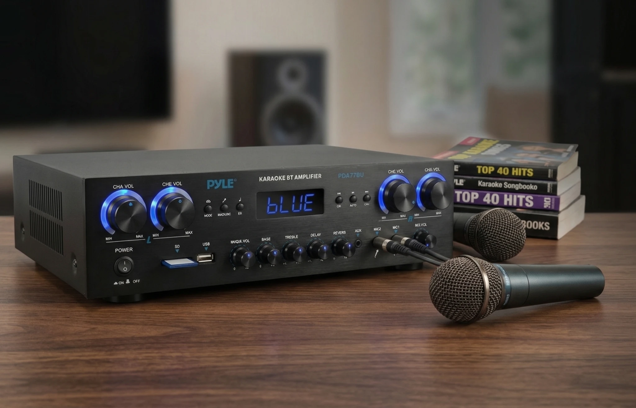 Pyle PDA77BU stereo receiver with microphones in a simple home audio karaoke setup