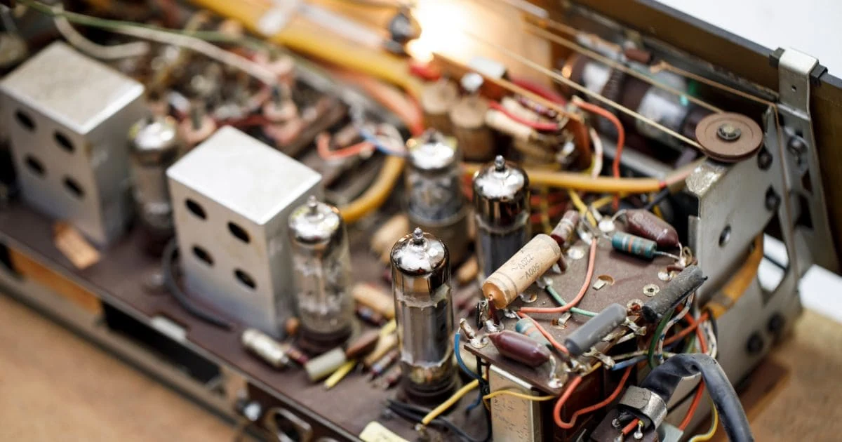 Car amplifier mounted in a vehicle trunk during a no-sound diagnosis