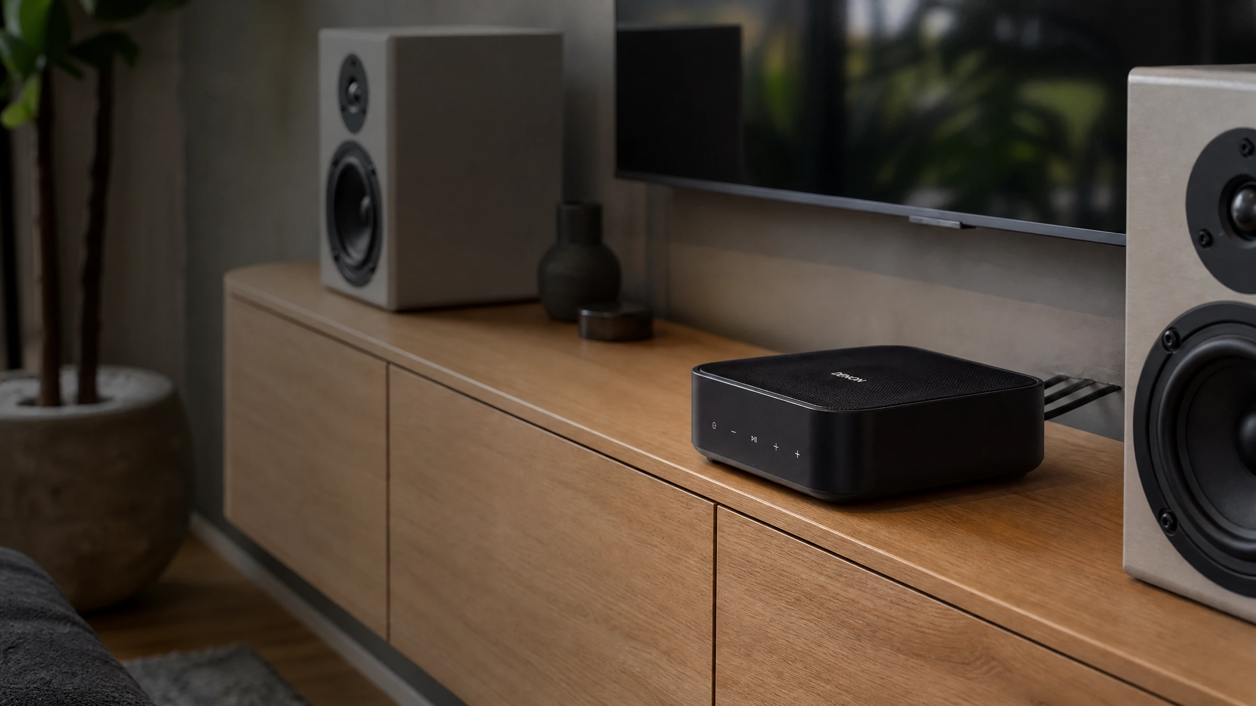 Denon HEOS Amp networked amplifier powering passive speakers in a home listening room